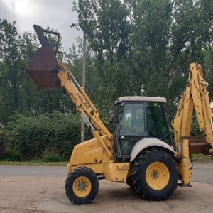 Rovokopac-utovarivac New Holland 75