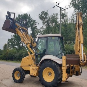 Rovokopac-utovarivac New Holland 75