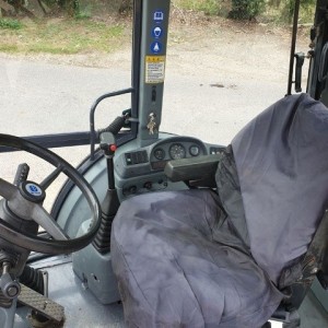 Rovokopac-utovarivac New Holland 75