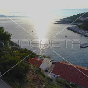 Građevinsko zemljište 437 m² s idejnim projektom i građevinskom dozvolom – uvala