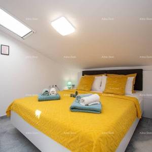 Medulin. Mukalba. Moderan apartman sa velikom terasom i pogledom na more.