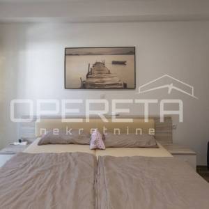 Stan u prizemlju s grijanom bazenom.