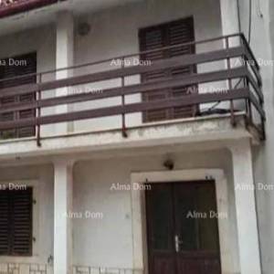 Kuća u centru Marčane s vrtom.