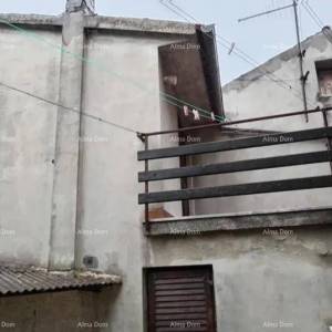 Kuća u centru Marčane s vrtom.