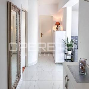 Stan s vrtom i garažom prenamijenjenom u stambeni prostor