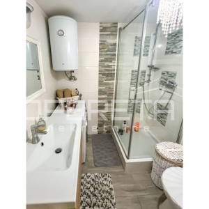 Stan s vrtom i garažom prenamijenjenom u stambeni prostor