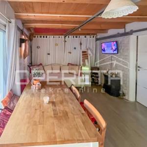 Stan s vrtom i garažom prenamijenjenom u stambeni prostor