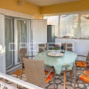 Stan s vrtom i garažom prenamijenjenom u stambeni prostor