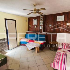 Kuća s pomoćnim objektom, pogled, garaža, vrt, 330 m2, Karlobag