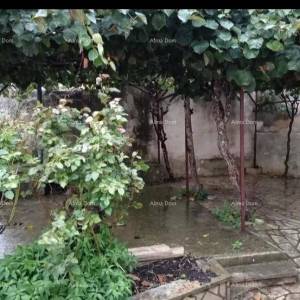 Kuća u centru Marčane s vrtom.