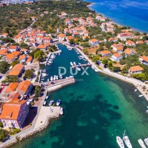 UGLJAN, POLJANA - građevinsko zemljište prvi red do mora 